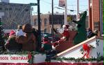 Santa Claus, the guest of honor in Kinston's annual Christmas parade, was escorted by a platoon of police cars to end the parade consisting of 99 enthusiastic and colorful participating units.